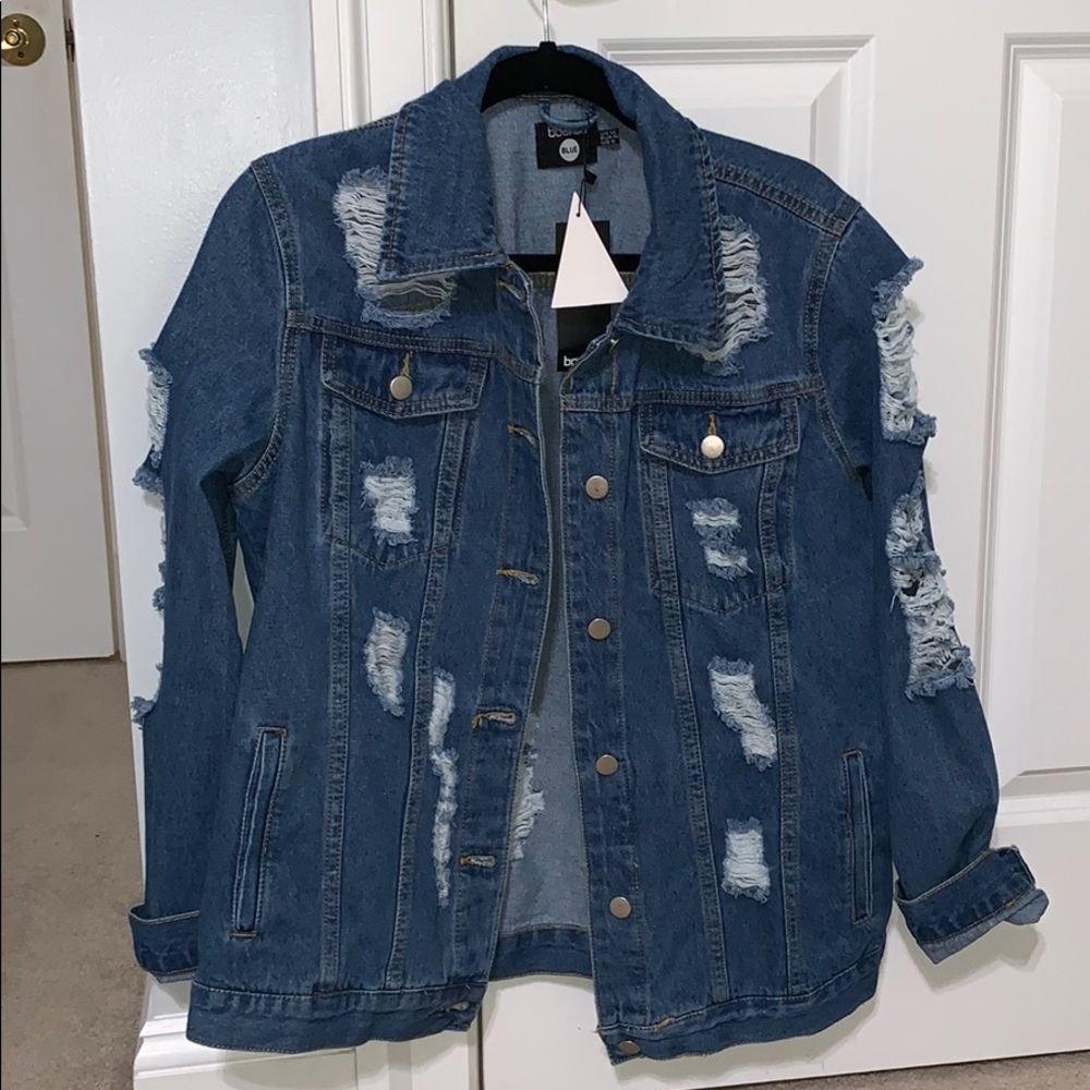 Blue jean jacket with holes